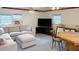 Bright living room with sectional sofa, ceiling fan, and large windows that offers natural light at 2567 Hyde Manor Nw Dr, Atlanta, GA 30327