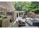 Inviting patio with comfortable seating, outdoor television, grill and garden at 2567 Hyde Manor Nw Dr, Atlanta, GA 30327