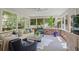 Bright sunroom with exposed brick, a ceiling fan and ample seating, perfect for relaxing at 2567 Hyde Manor Nw Dr, Atlanta, GA 30327