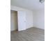 Bedroom with natural light from window and wood-look tile flooring at 385 Bethesda Park Trl, Lawrenceville, GA 30044
