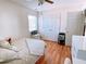 Bright bedroom with hardwood floors, a ceiling fan, and a well-lit space for a comfortable night's sleep at 385 Bethesda Park Trl, Lawrenceville, GA 30044
