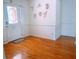 Entryway with hardwood floors, decorative wall art, and white door with stained glass at 385 Bethesda Park Trl, Lawrenceville, GA 30044