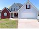 Charming two-story home with brick and siding, attached two car garage, and well-manicured lawn at 385 Bethesda Park Trl, Lawrenceville, GA 30044