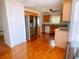 Well-lit kitchen featuring stainless steel appliances, wooden cabinets, and hardwood floors at 385 Bethesda Park Trl, Lawrenceville, GA 30044