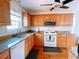 Kitchen with stainless steel appliances, granite countertops, and hardwood floors at 385 Bethesda Park Trl, Lawrenceville, GA 30044
