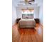 Inviting main bedroom with coordinated furniture, tray ceilings, and hardwood floors at 385 Bethesda Park Trl, Lawrenceville, GA 30044