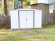 Backyard features a white outdoor storage shed, offering practical storage solutions for tools and garden equipment at 385 Bethesda Park Trl, Lawrenceville, GA 30044