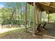 Covered outdoor patio area with wooded views and adjacent to the backyard at 4462 Cain Cir, Tucker, GA 30084