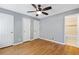 Cozy bedroom with hardwood floors, neutral walls, and generous closet space at 4462 Cain Cir, Tucker, GA 30084