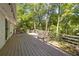 Spacious wooden deck with custom railings and views of the wooded backyard at 4462 Cain Cir, Tucker, GA 30084