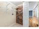Laundry area with shelving and exposed brick, plus a view into the home at 4462 Cain Cir, Tucker, GA 30084