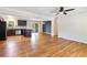 Open-concept living space featuring hardwood floors, recessed lighting, and seamless flow to dining and kitchen at 4462 Cain Cir, Tucker, GA 30084