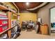 Unfinished basement area with a dining table, storage shelves, and exposed utilities at 5876 Bridgemont Nw Pl, Acworth, GA 30101