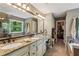 Granite vanity with double sinks and a garden tub near closet at 5876 Bridgemont Nw Pl, Acworth, GA 30101