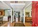 Elegant foyer with hardwood floors, high ceilings, and views into the dining and living spaces at 5876 Bridgemont Nw Pl, Acworth, GA 30101