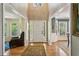 Bright foyer with hardwood floors, showcasing the home's open layout and natural light at 5876 Bridgemont Nw Pl, Acworth, GA 30101