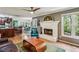 Open living area with fireplace, adjacent to the kitchen and breakfast nook at 5876 Bridgemont Nw Pl, Acworth, GA 30101
