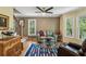 Cozy living room featuring a sitting area with comfortable furniture, hardwood floors, and natural light at 5876 Bridgemont Nw Pl, Acworth, GA 30101