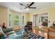Bright living room boasts bay windows and hardwood floors, leading to a dining area at 5876 Bridgemont Nw Pl, Acworth, GA 30101