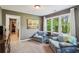 Bright sitting room with backyard view and comfortable chairs at 5876 Bridgemont Nw Pl, Acworth, GA 30101