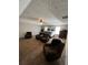 Spacious main bedroom featuring neutral walls, fan, sitting area, and a plush carpet at 1086 Deshon Trl, Lithonia, GA 30058