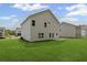 Exterior back of a new construction home featuring a flat backyard at 529 Lanier Way, Temple, GA 30179