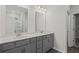 Well-lit bathroom featuring double sink vanity with marble countertops and stylish fixtures at 529 Lanier Way, Temple, GA 30179