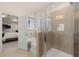 Bright bathroom featuring a walk-in shower, soaking tub, and modern fixtures, adjacent to main bedroom at 529 Lanier Way, Temple, GA 30179