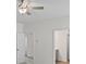 Bright bedroom with ceiling fan and adjacent bathroom and hallway featuring neutral walls at 529 Lanier Way, Temple, GA 30179
