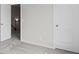Neutral bedroom with carpet and white paneled doors leading to the hallway and closet at 529 Lanier Way, Temple, GA 30179