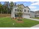 Well-manicured front yard leads up to this two-story home with attractive landscaping at 529 Lanier Way, Temple, GA 30179