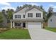 Charming two-story home with a well-maintained lawn and a two-car garage at 529 Lanier Way, Temple, GA 30179
