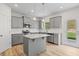 Modern kitchen with granite countertops, stainless steel appliances, and ample cabinet space at 529 Lanier Way, Temple, GA 30179