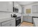 Updated kitchen with stainless appliances, granite countertops, and subway tile backsplash at 529 Lanier Way, Temple, GA 30179