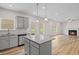 Modern kitchen with granite countertops, stainless steel appliances, island, and lots of natural light at 529 Lanier Way, Temple, GA 30179