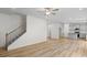 Open concept space with grey kitchen, island, stainless appliances, and hardwood floors at 529 Lanier Way, Temple, GA 30179