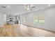 Open-concept living space with abundant natural light, hardwood floors, and grey kitchen at 529 Lanier Way, Temple, GA 30179