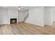 Spacious living room featuring a cozy fireplace and hardwood style flooring at 529 Lanier Way, Temple, GA 30179