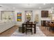 Inviting living and dining area with wood floors and a view of the modern kitchen at 529 Lanier Way, Temple, GA 30179