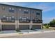 Desirable townhome with a two-car garage, private balcony, and neutral gray siding at 529 Rubato Knl, Mcdonough, GA 30253