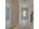 Inviting foyer featuring light wood flooring, an open layout, and ample natural light creating a welcoming entrance at 529 Rubato Knl, Mcdonough, GA 30253
