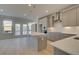 Bright kitchen with gray cabinets, quartz countertops, stainless steel appliances, and a large center island at 529 Rubato Knl, Mcdonough, GA 30253