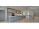 Spacious kitchen with gray cabinets, stainless steel appliances, a large island, and hardwood floors at 529 Rubato Knl, Mcdonough, GA 30253