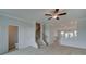 Open-concept living room with a staircase, showcasing modern flooring and ample natural light at 529 Rubato Knl, Mcdonough, GA 30253