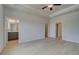 Large main bedroom with a tray ceiling and views to a bathroom and two closets at 529 Rubato Knl, Mcdonough, GA 30253