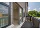 Outdoor patio featuring wood railings, siding, and a glimpse into the interior at 529 Rubato Knl, Mcdonough, GA 30253