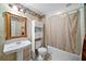 Full bathroom with a vanity, mirror, toilet, and shower-tub combination with a curtain at 614 Springharbor Dr, Woodstock, GA 30188