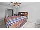 Bedroom with a built-in bed and dresser, plus a ceiling fan and a closet for storage at 614 Springharbor Dr, Woodstock, GA 30188