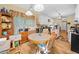 Bright breakfast nook with table, chairs, hutch and large window with a backyard view at 614 Springharbor Dr, Woodstock, GA 30188