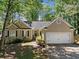 Charming one-story home featuring a two-car garage and a well-maintained front yard at 614 Springharbor Dr, Woodstock, GA 30188